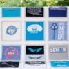 T-Shirt quilt straight on view over porch railing with trees in background
