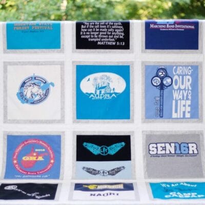 t shirt quilt mcd T-Shirt quilt straight on view over porch railing with trees in background