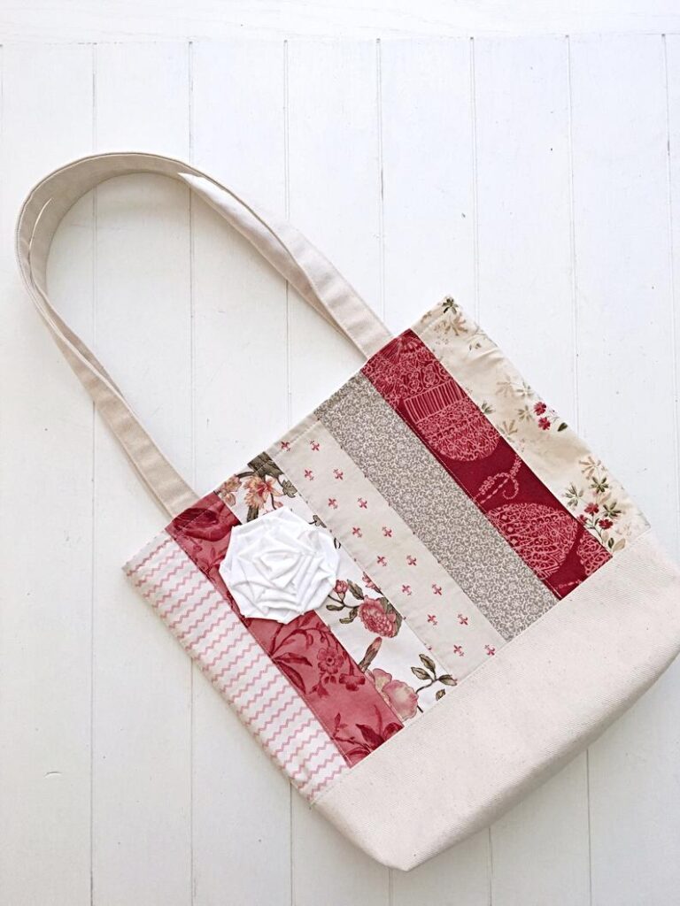 tote bag in a french country stye with beautiful applique of rose with striped fabric strips