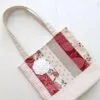 tote bag in a french country stye with beautiful applique of rose with striped fabric strips