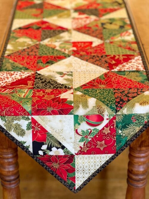 Holiday Diamonds Table Runner Pattern draped over wood table