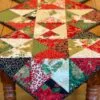 Holiday Stars table runner pattern draped on wood table