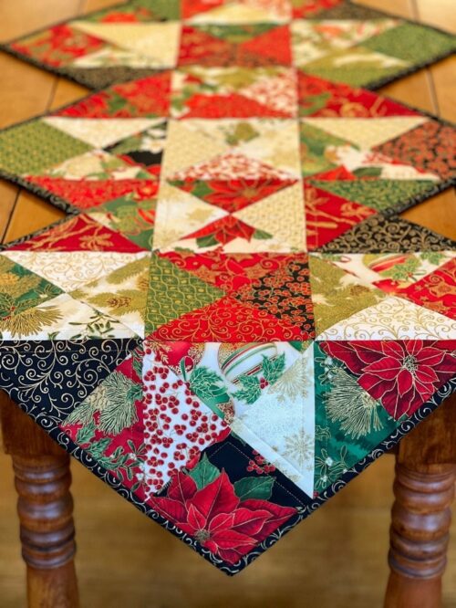 Holiday Stars table runner pattern draped on wood table
