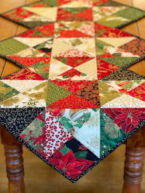 Holiday Stars table runner pattern draped on wood table