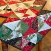 Holiday Stars table runner pattern draped on wood table
