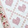 Hearts Delight quilt with machine quilting.