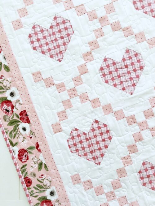 Hearts Delight quilt with machine quilting.